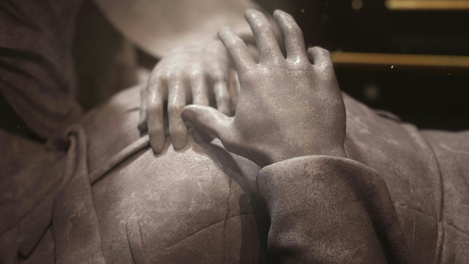 Closeup on the hand of one of the statues